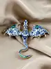 broche dragon en émail bleu et métal doré
