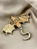 broche dragon en émail bleu et métal doré