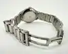 montre baume & mercier linea 65616 avec une lunette ornée de diamants et mouvement quartz, bracelet en acier