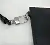 pochette montblanc en cuir lisse noir et bleu avec dragonne amovible