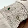 97438658 bracelet jonc ouvert, perlé, orné d’oxydes verts
