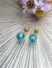 boucles d'oreilles avec boule bleue en verre de feuille d'or or 750 millième (18 ct) 1,82g
