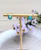 boucles d'oreilles avec boule bleue en verre de feuille d'or or 750 millième (18 ct) 1,82g