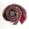 cravate hermès 100% soie rouge à motifs pommes, fleurs et feuillage