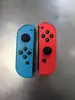 paire de joycon officiel nintendo bleu et rouge