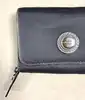 porte monnaie lancel en toile et cuir