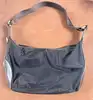 sac lancel porté épaule en toile noir et cuir marron