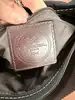 sac lancel porté épaule en toile noir et cuir marron