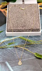 collier pendentif sur chaîne forçat menottes dinh van centré d'un diamant d'environ 0,08ct or 750 millième (18 ct) 2,09g