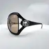 lunettes de soleil gucci gg 2995/s ornées du logo gucci avec des verres marron clair