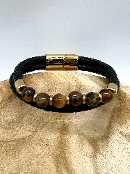 brac bracelet en cuir noir tressé, oeil de tigre d8mm, fermoir en acier doré l21 cm