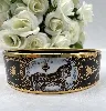 bracelet hermès émail cloisonné noir et or motifs équestres