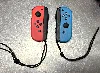 paire de joycon officiel nintendo bleu et rouge