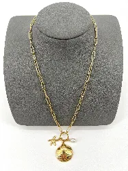 31227750 collier chaîne avec pendentif coquillage et étoile en acier doré