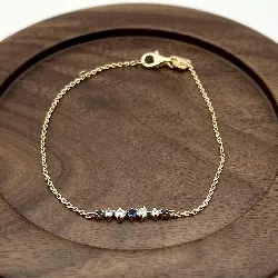 97411918 bracelet pl-or orné d'une ligne d'oxydes bleus