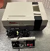 console nintendo entertainment system nes avec une manette