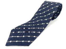 cravate hermès 100% soie fond bleu marine à motifs chaînes blanches