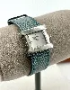 montre pequignet sorella boîtier argenté et bracelet en cuir bleu
