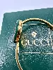 montre gucci play 1100l cadran blanc et boîtier et bracelet rigide en métal doré avec 12 lunettes interchangeables, muvement à qua