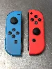 paire de joycon officiel nintendo bleu et rouge