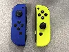 paire de manette joy con bleu/jaune