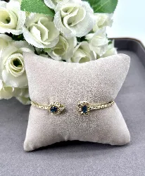 bracelet jonc ouvert en métal doré avec oxydes bleus