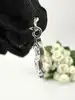 pendentif charm thomas sabo dollar serti d'oxydes de zirconium blancs argent 925 millième (22 ct) 1,83g