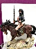 figurine statuette amazone orientale avec fusil sur cheval