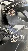 chanel paire de sandales en cuir noir à talons 4,5cm bride ornée d'une chaine en métal argenté logotée