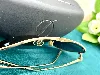 s t dupont lunettes de soleil aviateur en métal dotré, verres noires, nez en cuir noire