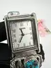 montre harpo paris en argent massif et turquoises mouvement quartz avec cadran rectangulaire et bracelet extensible en acier inoxy
