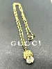 collier gucci en métal or vieilli motif tête de lion avec un oxyde ovale blanc