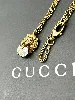 collier gucci en métal or vieilli motif tête de lion avec un oxyde ovale blanc