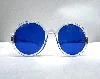 lunettes de soleil chanel avec des verres bleus et la monture et les branches transparentes
