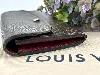 portefeuille louis vuitton émilie long en toile monogram et l'intérieur en cuir de veau grainé rouge