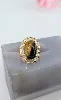 bague or ornée d'une pierre  l'oeil de tigre en cabochon or 750 millième (18 ct) 6,54g