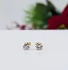 boucles d'oreilles puces chacune sertie d'un oxyde rond or 750 millième (18 ct) 1,12g