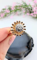 bague fleur en or & platine centrée d'un diamant d'environ 0,05ct or 750 millième (18 ct) 4,11g