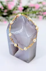 bracelet or motifs ajourés alternés de 8 perles de culture or 750 millième (18 ct) 2,78g