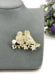 broche en forme d’oiseaux pavée d’oxydes en métal doré