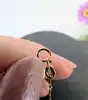 collier maille fantaisie limée orné d'un pendentif coeur serti de petits oxydes or 750 millième (18 ct) 2,09g