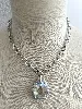 collier swarovski avec pendentif en cristal incolore et strass irisés