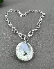 collier swarovski avec pendentif en cristal incolore et strass irisés