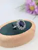 bague marquise centrée d'un saphir synthétique d'environ 2,5ct entouré des quartz blancs or 375 millième (9 ct) 3,75g