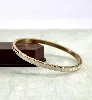 brac bracelet jonc en acier doré et émail blanc style géographique