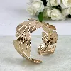 bracelet / manchette motif feuille en acier doré