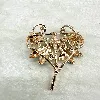 broche motif libellule en émail et en acier doré sertie d'oxydes