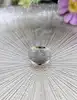 bague bombée large en 2 ors avec une pavage de petits diamants or 750 millième (18 ct) 5,98g