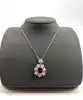 collier pendantif pierre rouge et oxydes