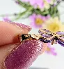pendentif croix en améthystes facettées centré d'un oxyde or 750 millième (18 ct) 1,98g